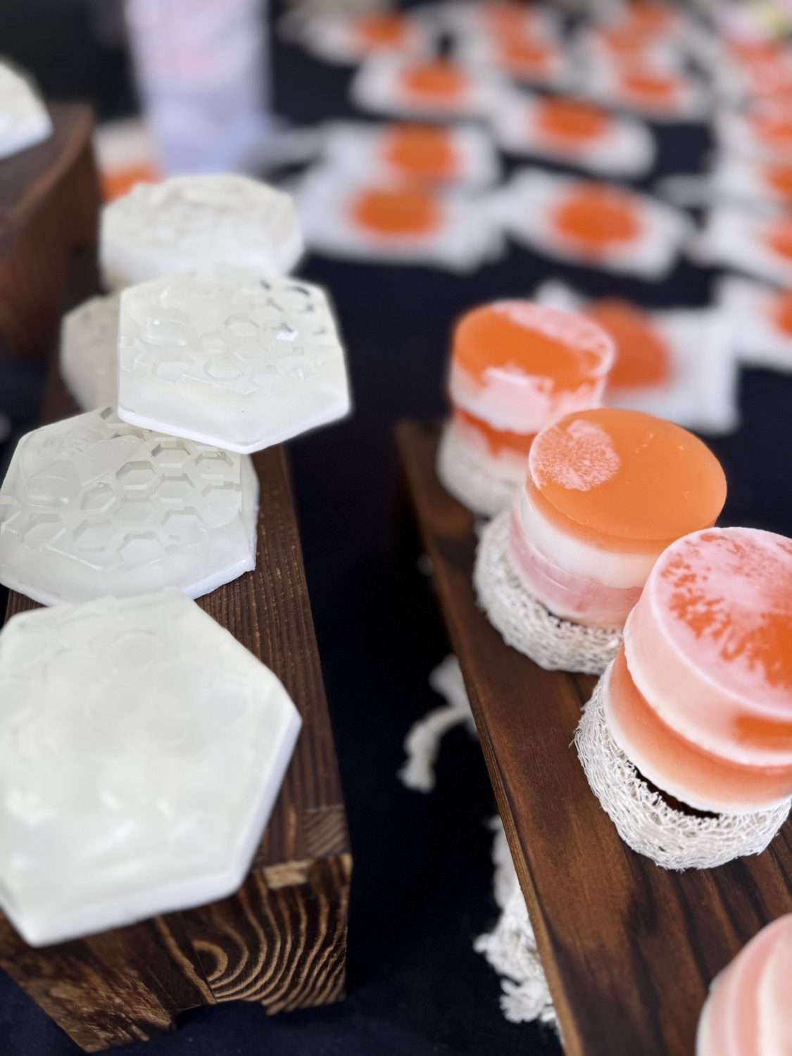 Hexagonal honeycomb-pattern soaps and layered orange and white soaps