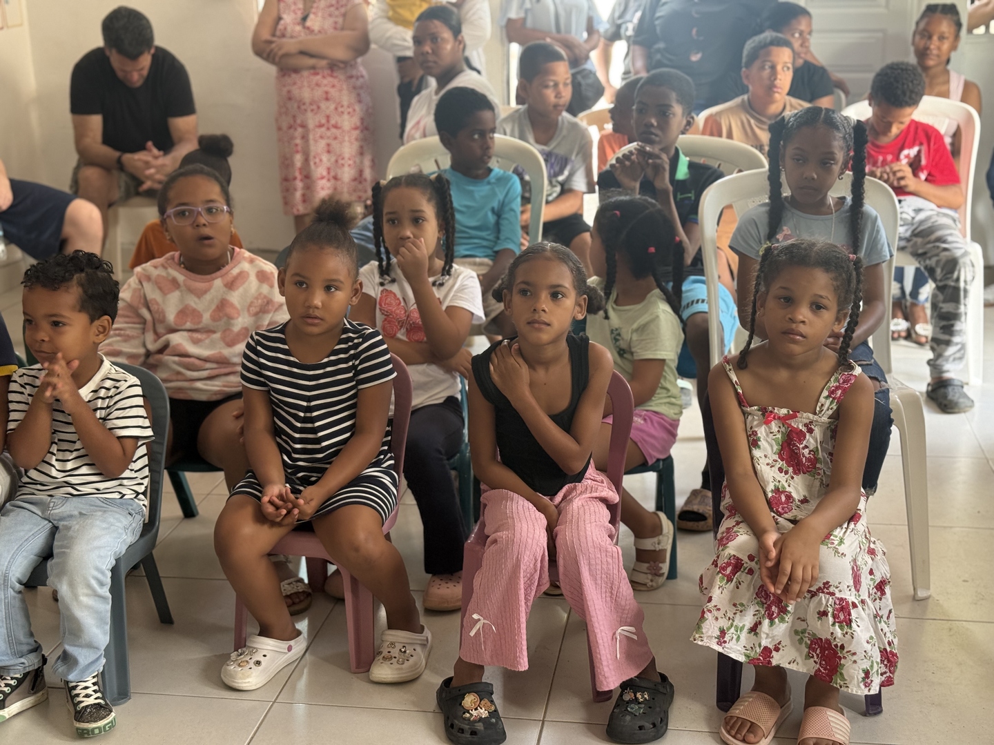 Children seated and engaged at a church gathering