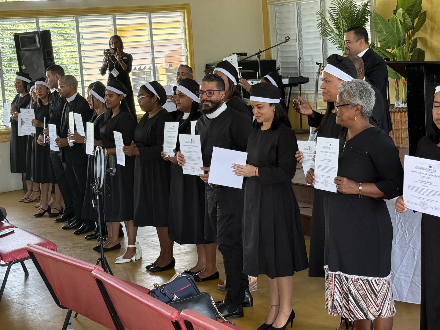 Church leaders receiving ordination certificates